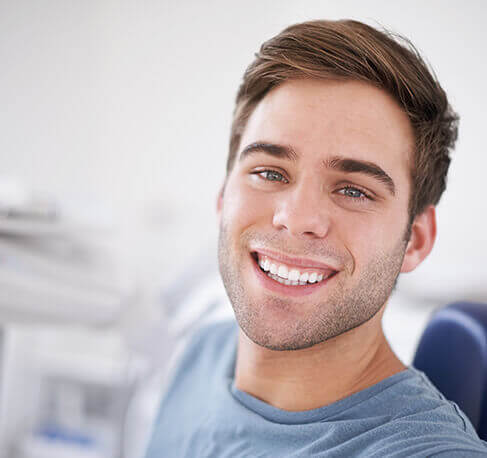 smiling man in dental office